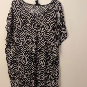 Longer thin bathing suit cover up or can be worn as a top